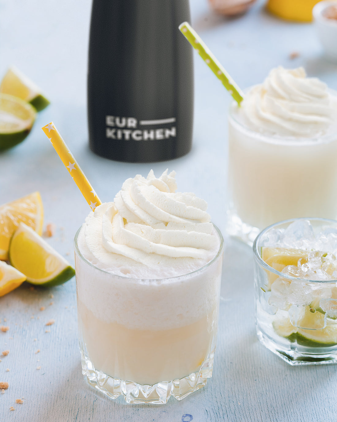 EurKitchen Whipped Cream Dispenser next to a refreshing lime drink 